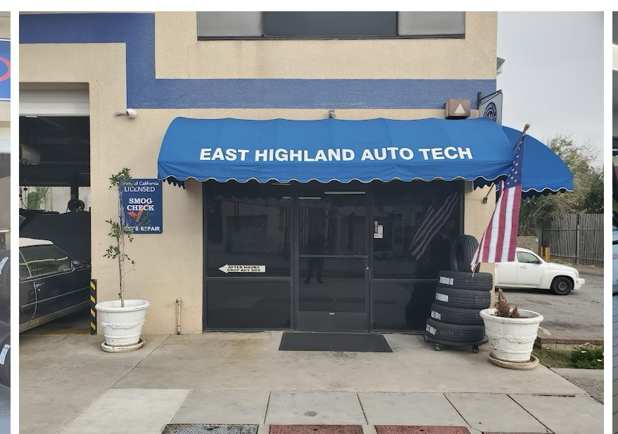 East Highland Auto Tech’s actual entrance with blue awning, American flag and glass doors